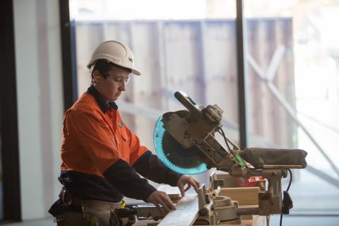 Female Carpenter with circular saw